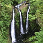 Triple Falls -- actually one creek split in three. See the people at the top?