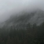 A mountain trying to emerge from the clouds.